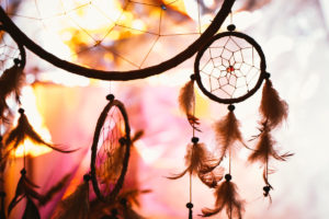 photo of a dream catcher at sunset